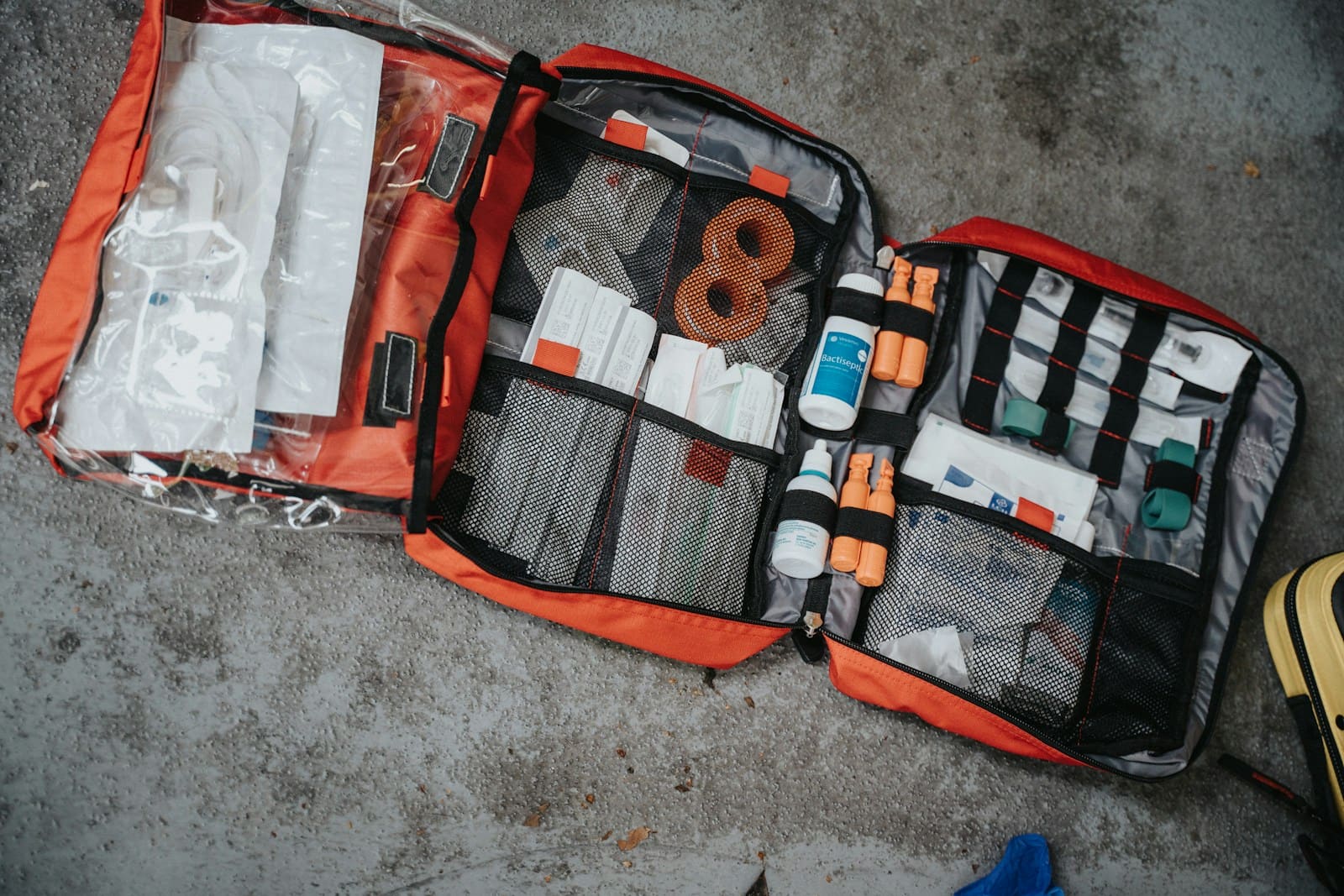 Open red medical bag packed with supplies