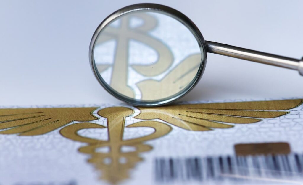 Magnifying glass over a medical label with a barcode