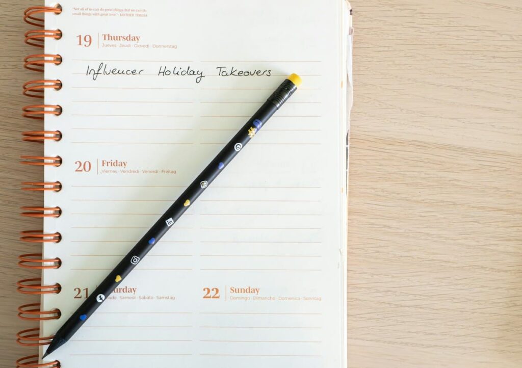 Notepad with a pen resting on top