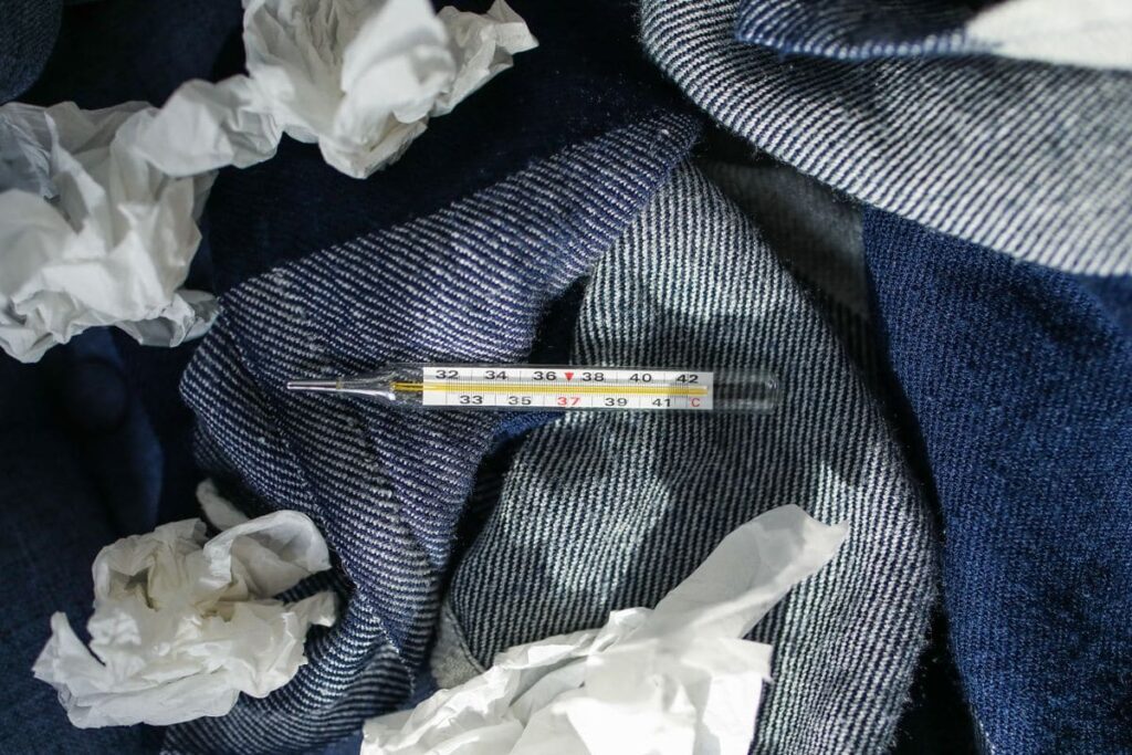 Thermometer and crumpled tissues