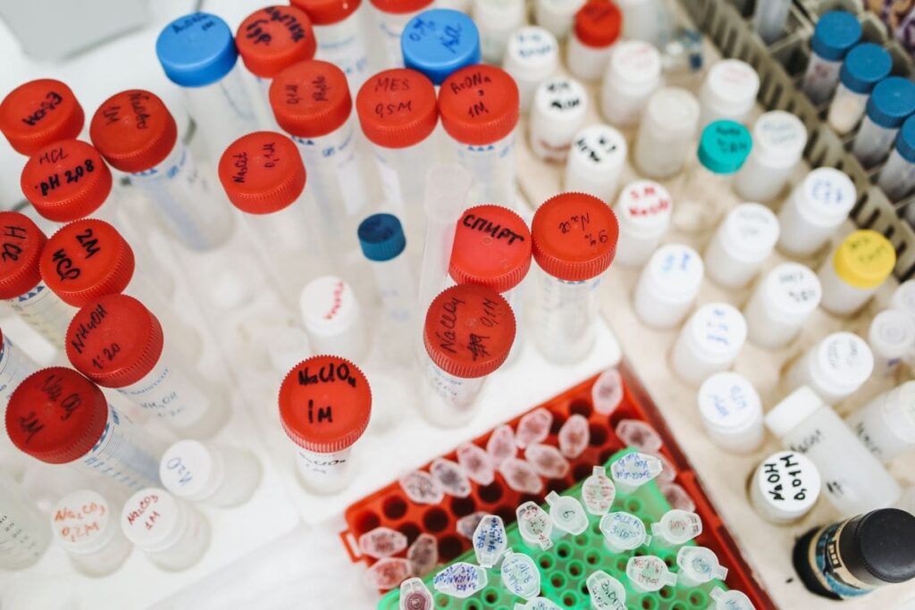 Laboratory test tubes and bottles with colourful caps