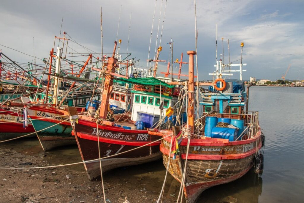 Colourful fishing boats moored by the seafront in Pattaya