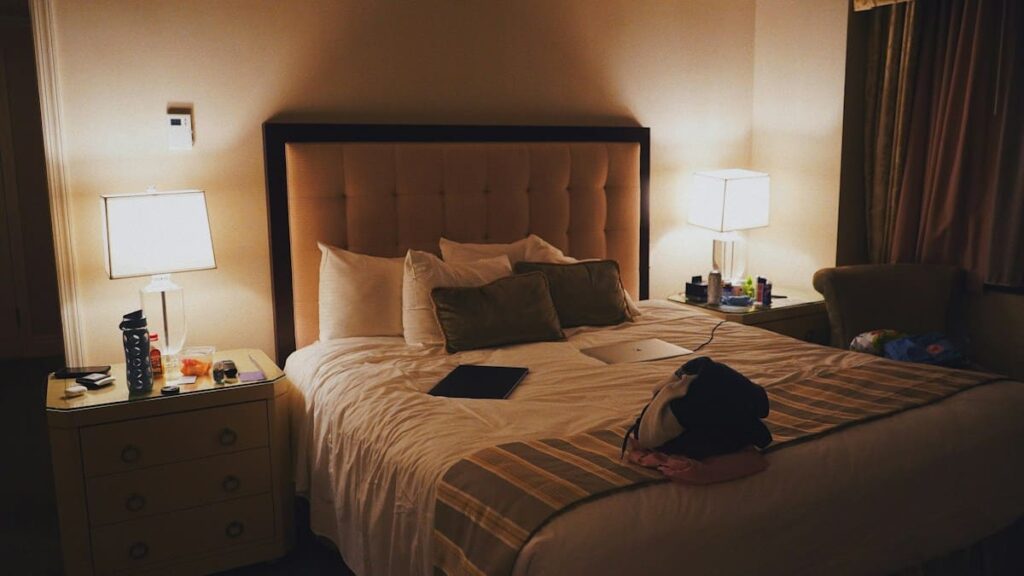 Hotel bedroom with a bed and a nightstand