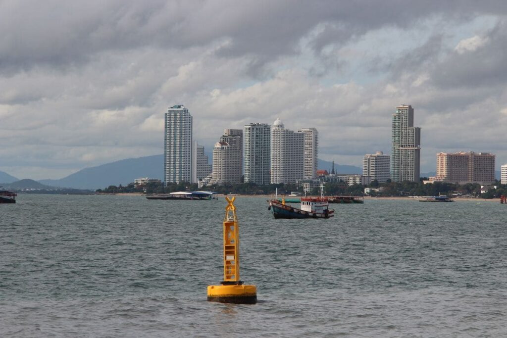 Pattaya skyline and boats in the bay on a cloudy day