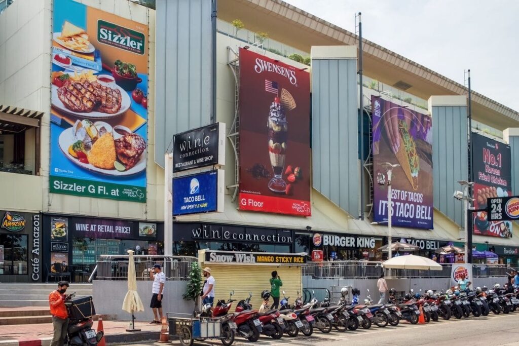 Shopping mall frontage with large signs in Pattaya