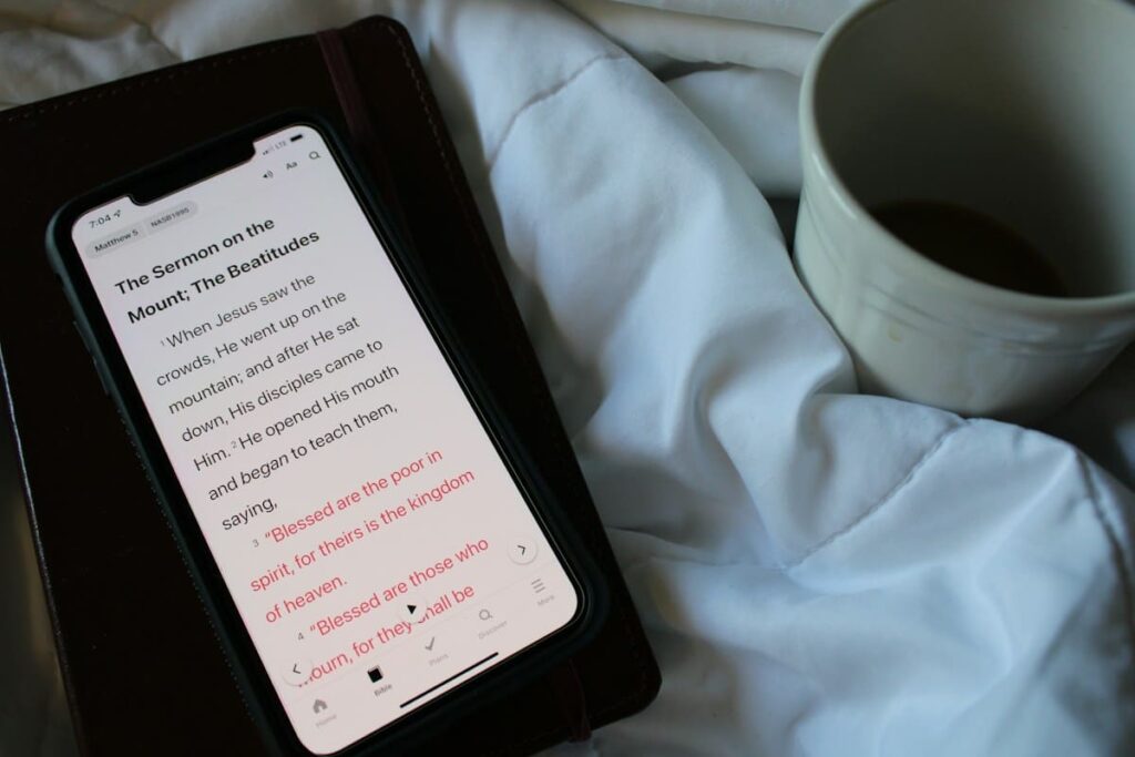 Smartphone lying on a bed sheet