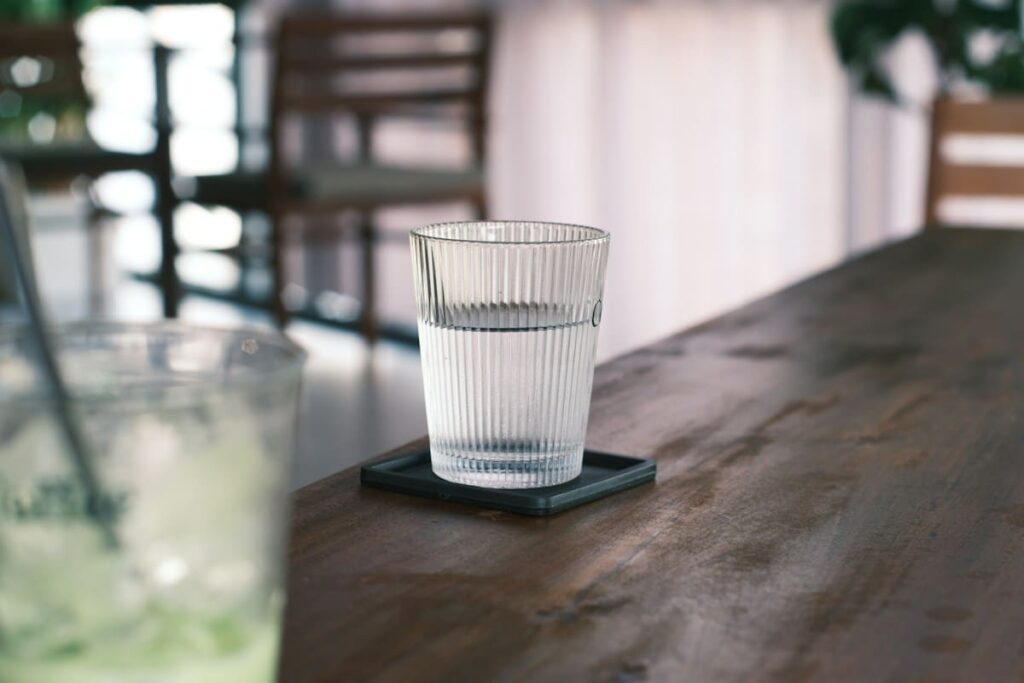 Glass of water on a wooden table
