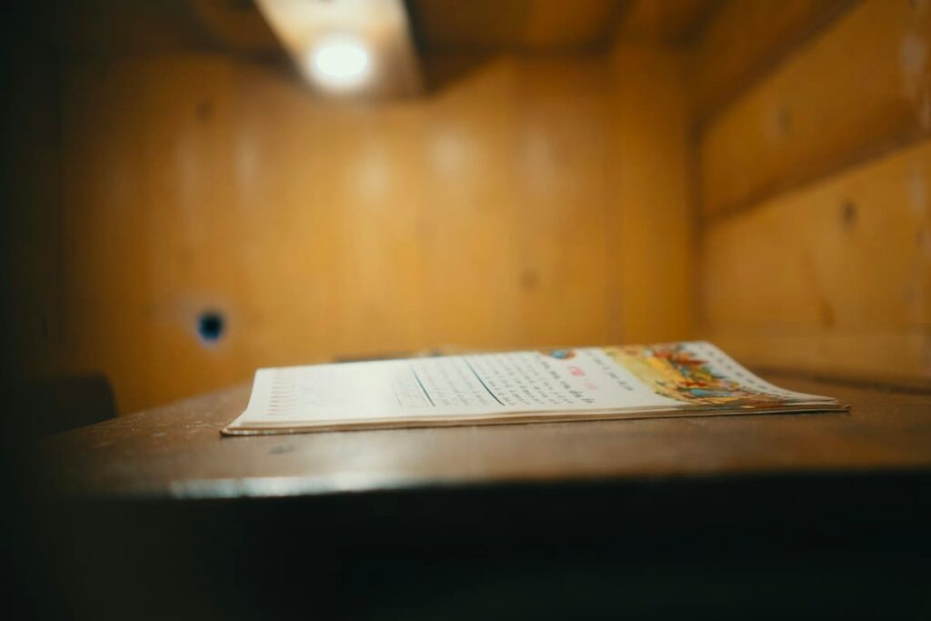 Printed document lying on a wooden table