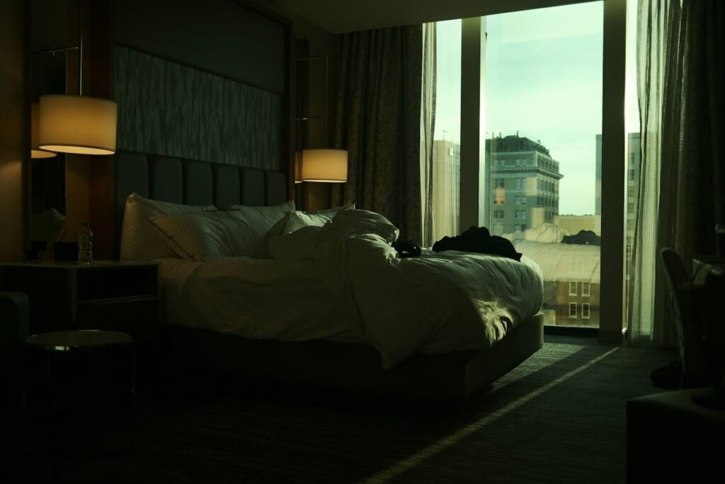 Bedroom with a large bed and a large window