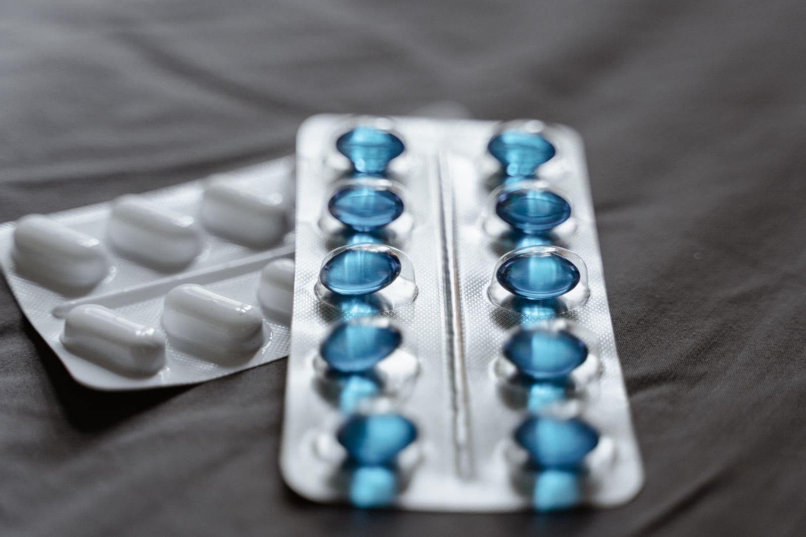 Blister packs of blue capsules